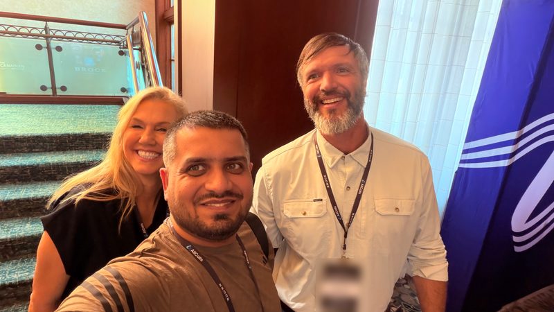 Group selfie of Wali Zuberi with two fellow attendees at MedicareCon 2026